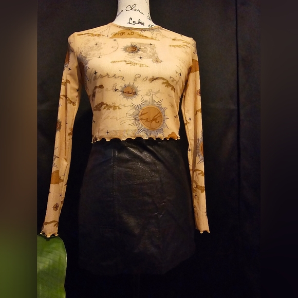 Sheer nudes color, crew neck crop top with ruffled edges on sleeves and torso. - Picture 6 of 7